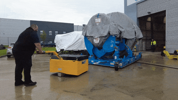 electric tow tug moving jet engine
