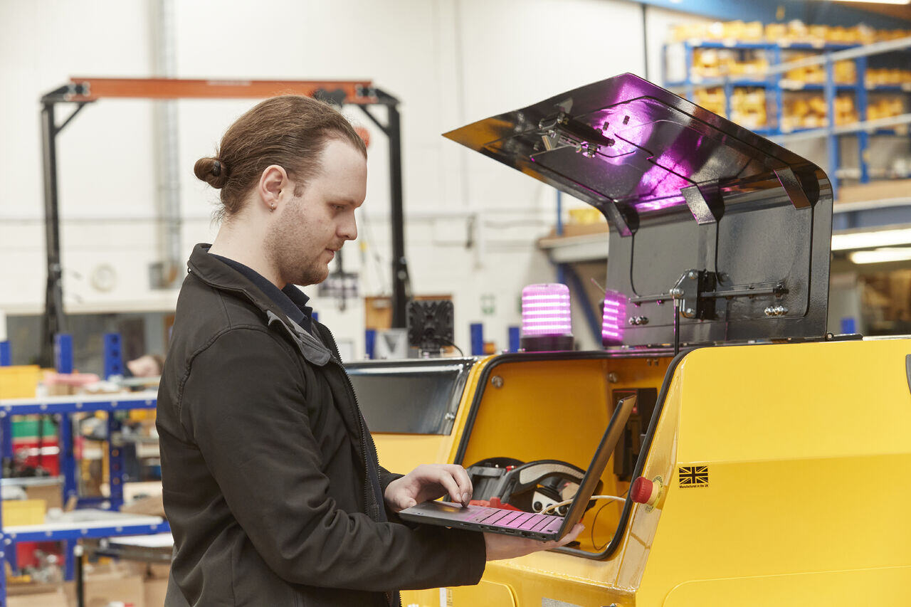 MasterMover engineer working on an electric tug