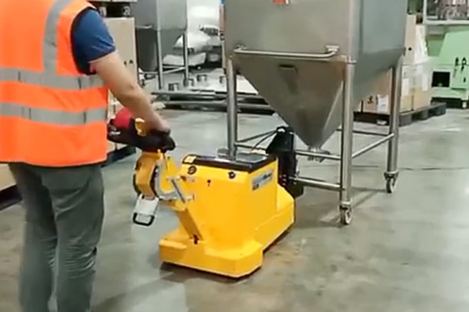 electric tug moving food hopper