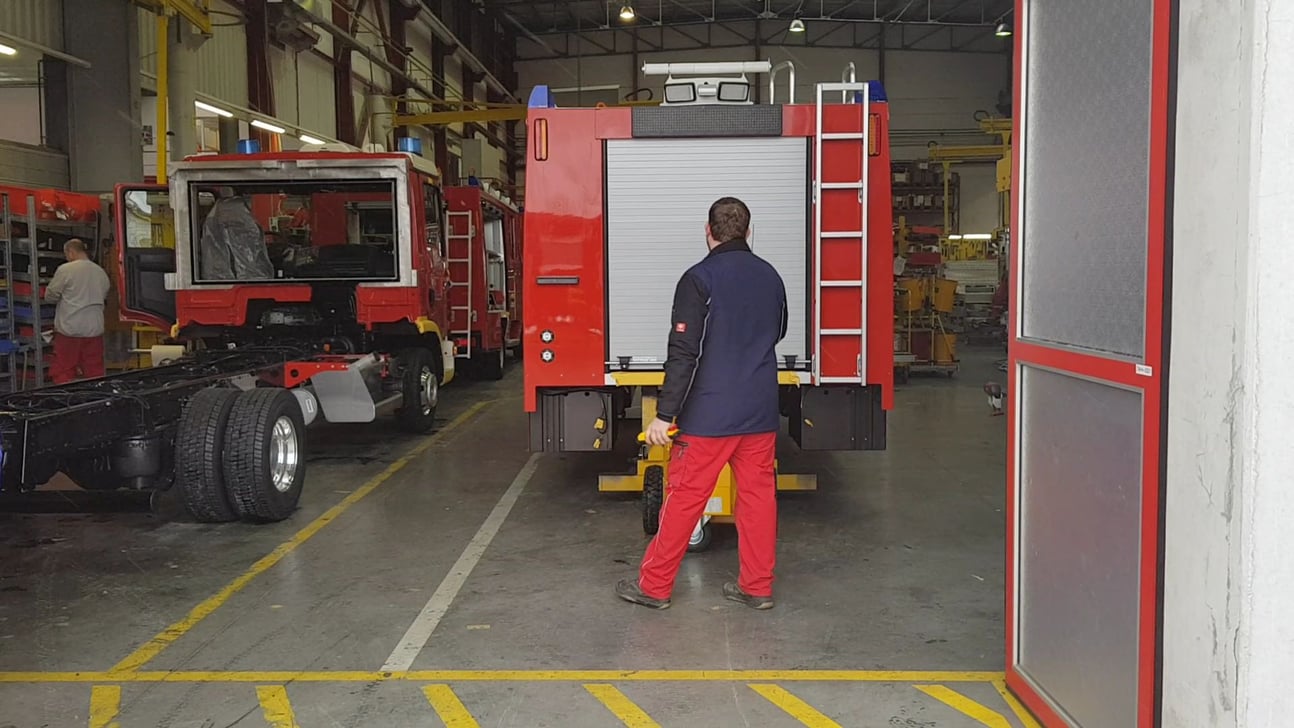 Electric tug in fire truck factory