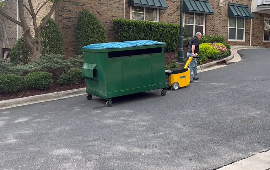 Dumpster mover going up a slope