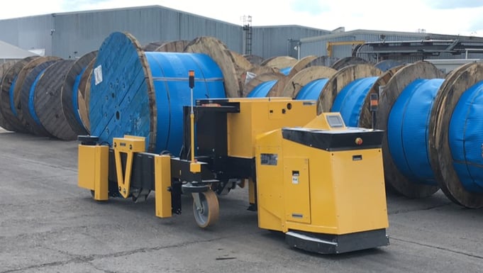 electric tug moves large cable drum