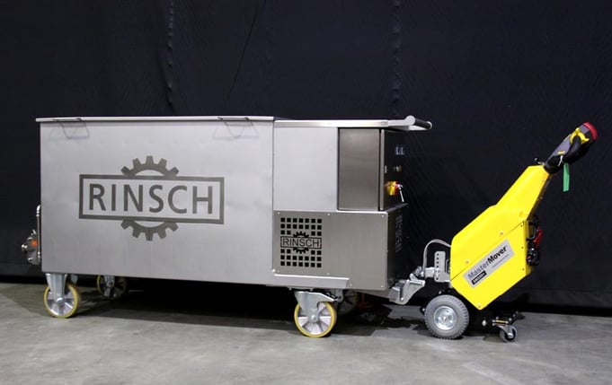 Electric tug moving Rinsch chocolate container 