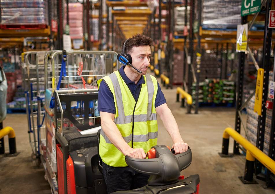 Electric tow tractor in a warehouse