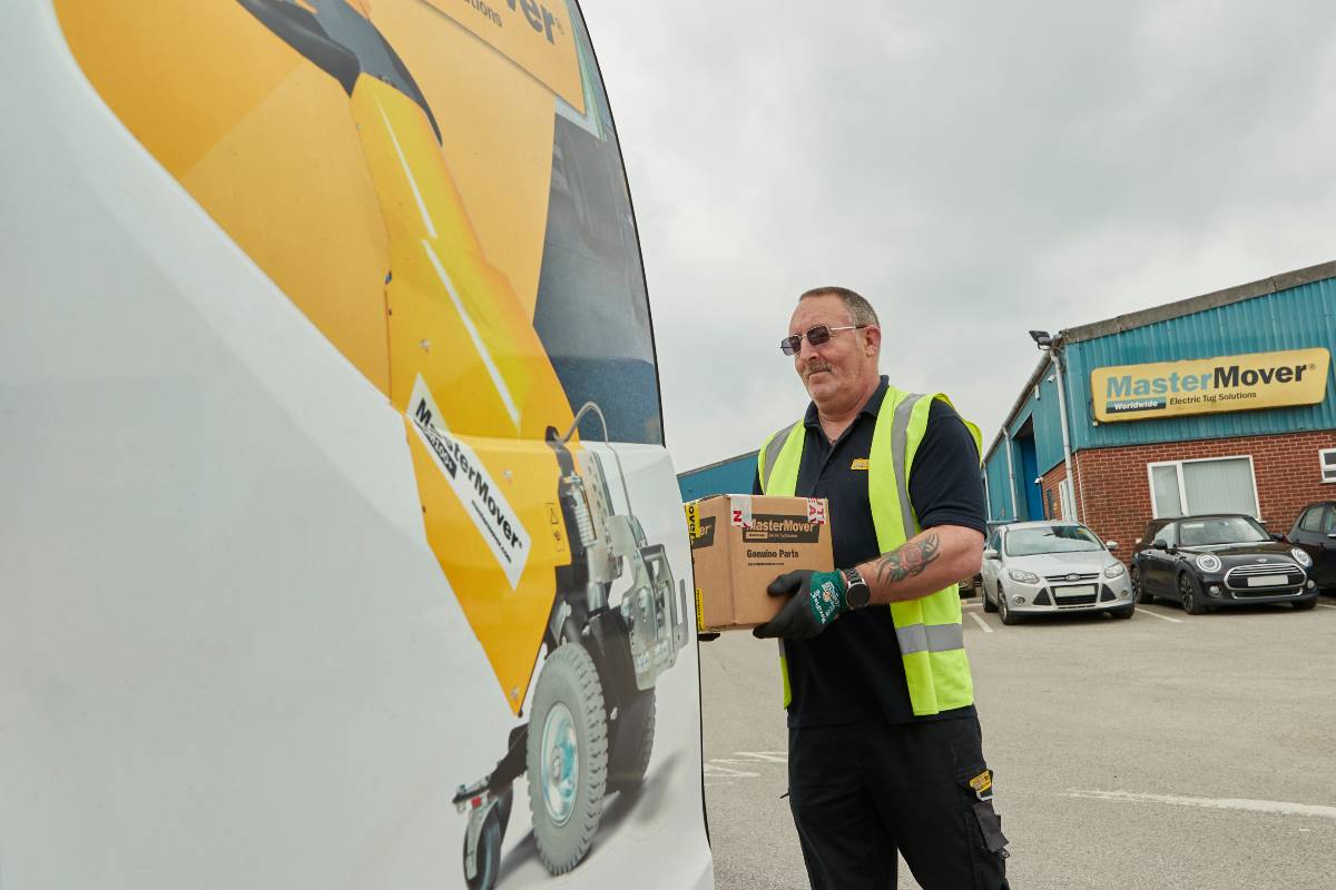 Electric tug parts being  loaded on to a van