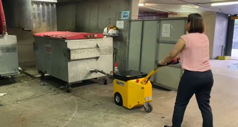 MasterTow TOW200 moving a commercial waste bin in Australia