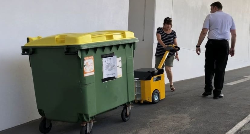 MasterTow TOW200 moving a commercial waste bin up a slope