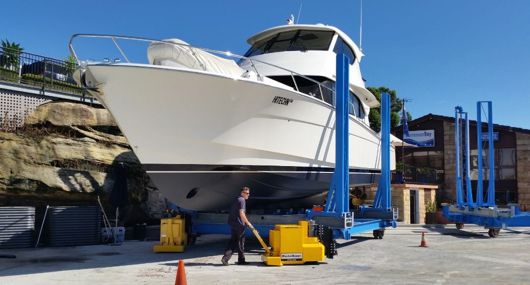 2 MasterTug electric tuggers moving a yacht on a cradle