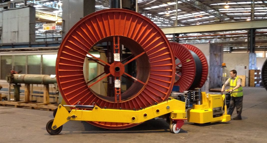 MasterTug moving a large wire reel