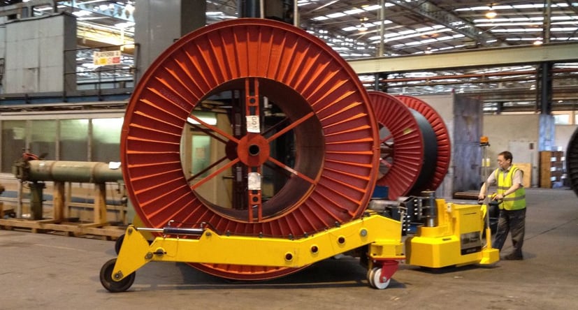 MasterTug moving a large wire reel