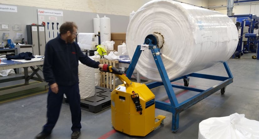 MasterHandler MH400+ moving a finished roll of textiles on an a-frame