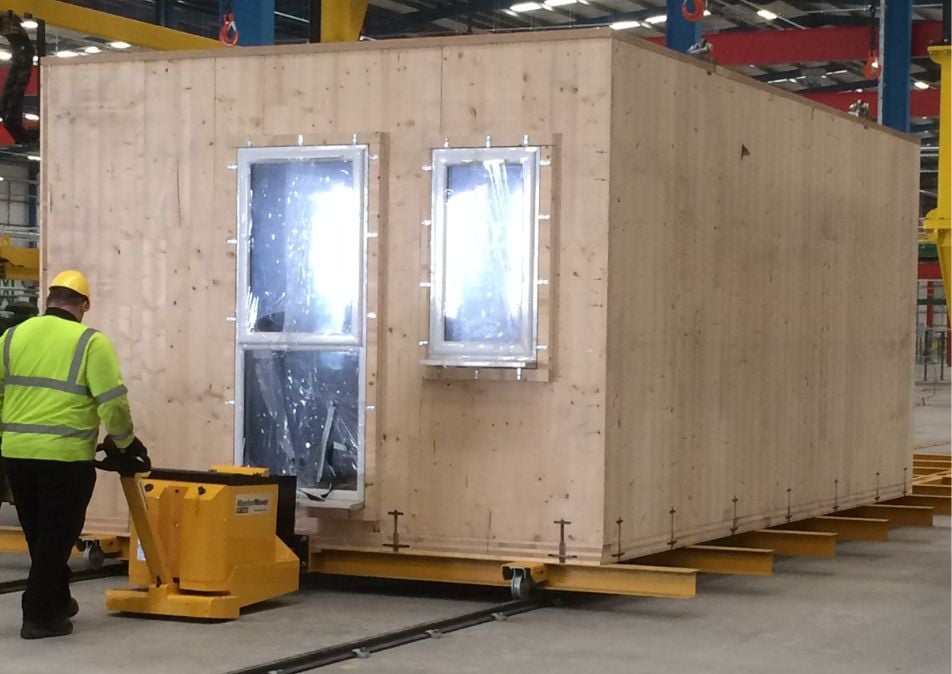 MasterTug moving a modular building during construction