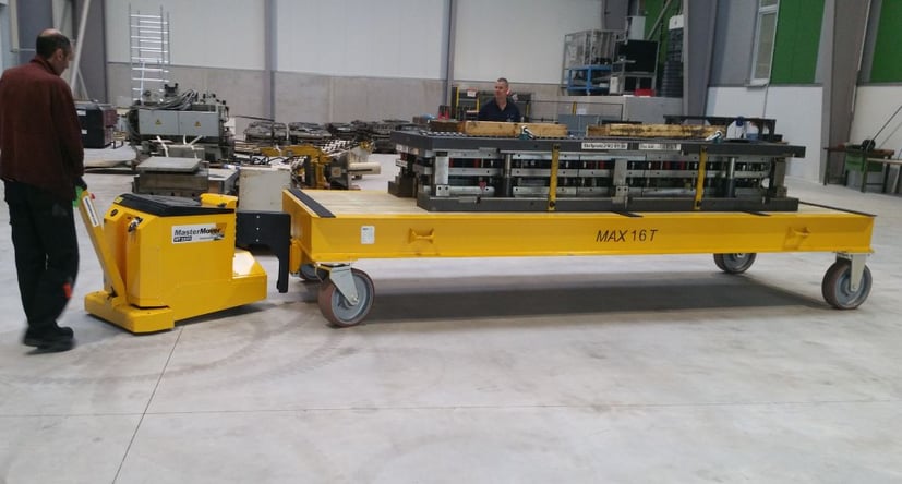 MasterTug MT1500+ moving steel components on a trolley