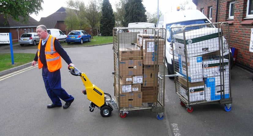 SmartMover SM100+ moving multiple cages across a road at a hospital