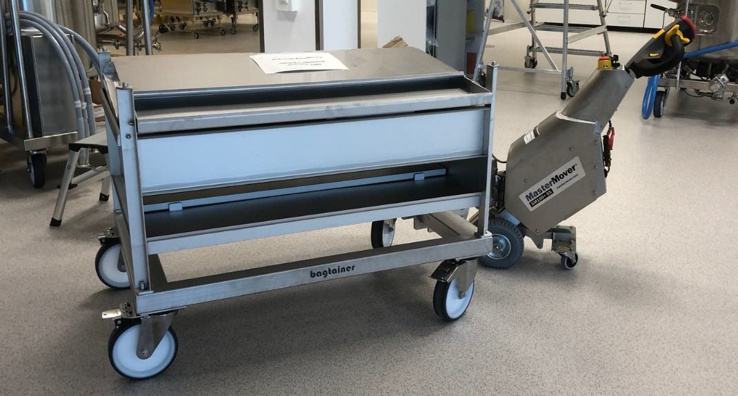 Stainless Steel SmartMover SM100+ moving a stainless steel biopharmaceutical tote