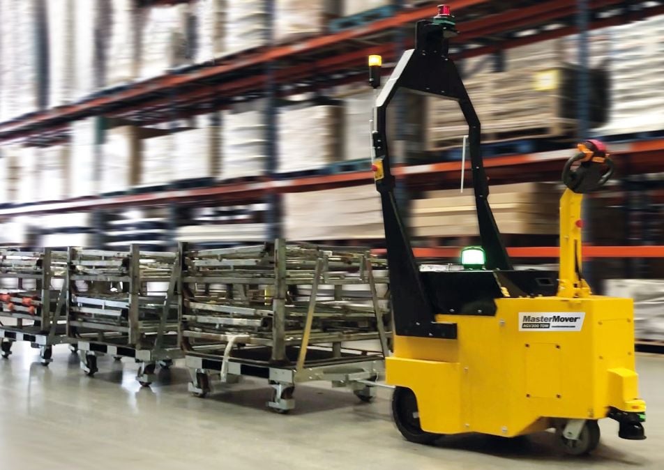 AGV300 TOW pulling cages through a warehouse