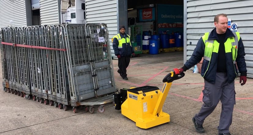 MasterTug MT200 moving nested roll cages outside a warehouse