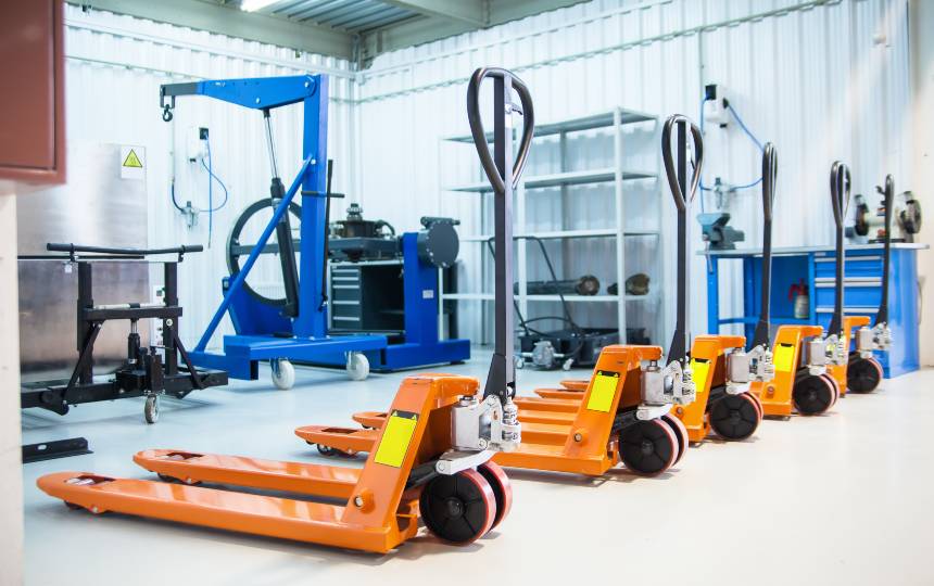 Collection of pallet trucks / pump trucks in a warehouse