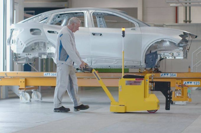 electric tug moving car in automotive